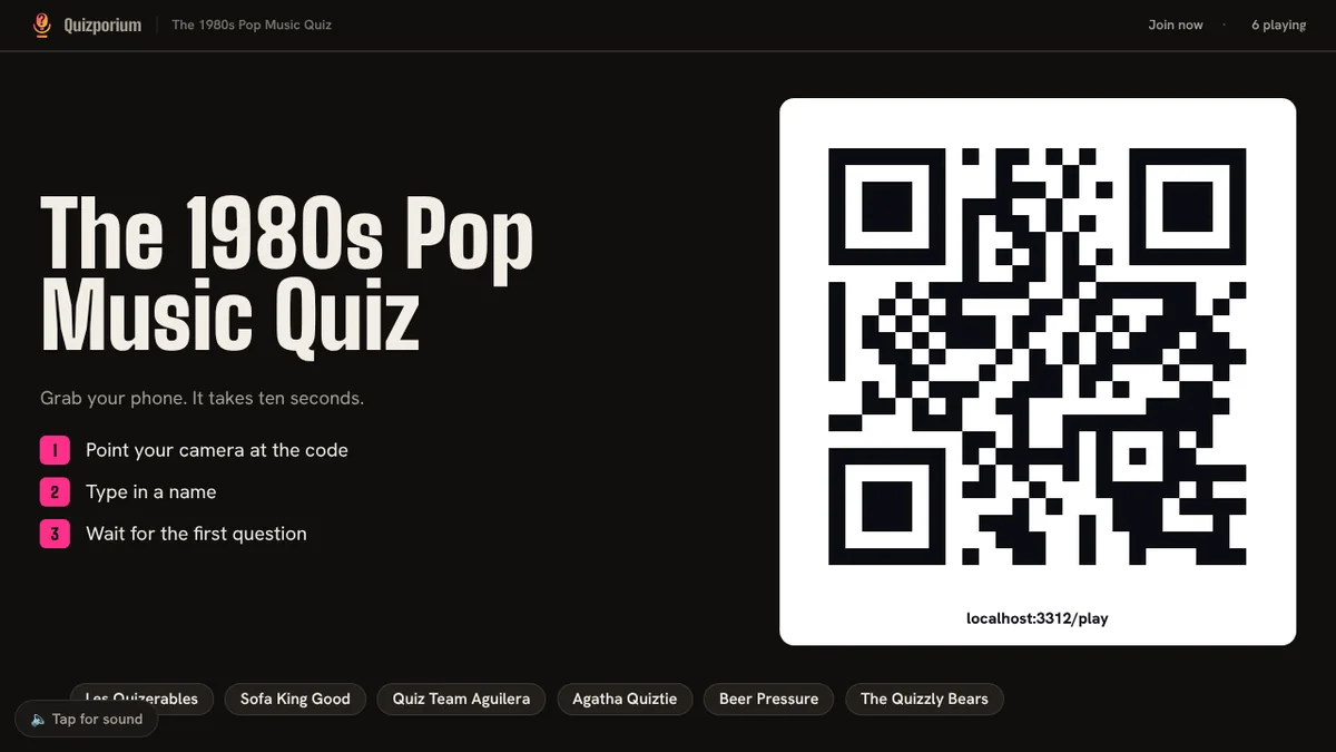 The projector before kick-off, showing a large QR code and how to join.